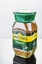 Jacobs Kronung coffee isolated on gradient background.