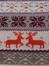 Jacquard knitted pattern. Geometric ornament for Christmas or New Year. Two red deer on a white knitted background