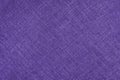 Jacquard woven upholstery, bright purple coarse fabric texture with diagonal weave lines, close up