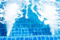 Jacuzzi swimming pool with bubbles blue water for massage and spa Royalty Free Stock Photo