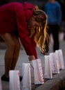 Girl lights luminary for Melissa Jenkins Memorial Royalty Free Stock Photo