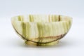 Jade bowl with abstract stripe pattern on white backgro