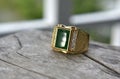 Jade is a gold ring decorated with green jade. beautiful