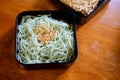 Jade noodles with fried garlic in black tray