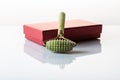Jade stone roller for a rough facial massage. Massager for face and body Royalty Free Stock Photo