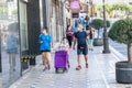 Jaen, Spain - June 18, 2020: People walking by the city wearing protective or medical face masks during the new normal due to