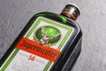 Jagermeister digestif on stone slate background.