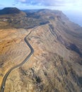 Jagged coasts and cliffs overlooking the ocean. Aerial view. Lanzarote, road leading to the Mirador del Rio.