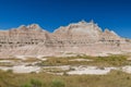 Jagged, colorful peaks above meadows in Badlands National Park
