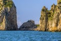 The jagged Faraglioni rocks frame an abandoned beach bar on the eastern side of the Island of Capri, Italy Royalty Free Stock Photo