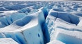 Jagged ice formations create a deep crevasse cutting through a glacial surface. Royalty Free Stock Photo