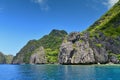 Jagged limestone cliffs of Matinloc Island at Palawan in Philippines Royalty Free Stock Photo