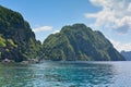 Jagged limestone cliffs of Matinloc Island at Palawan in Philippines Royalty Free Stock Photo