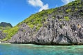 Jagged limestone cliffs of Matinloc Island at Palawan in Philippines Royalty Free Stock Photo