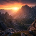 Jagged mountain peaks bathed in the warm hues of a setting sun create a dramatic Royalty Free Stock Photo