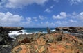 Jagged Rocks In Front of Aruba`s Black Sand Stone Beach