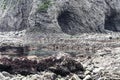 Jagged Stone Beach with Rocks and Caves