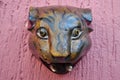 Jaguar head carved in wood decoration on a pink wall Royalty Free Stock Photo