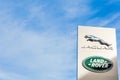 Jaguar Land Rover brand logo blue sky background