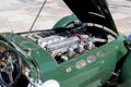 Jaguar retro vintage sports car engine close up. Restored motor of green antique automobile