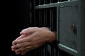 Jail Cell Door And Hands Royalty Free Stock Photo