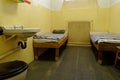 Jail cell with two bunk beds and sink are exposed in the Stasi Museum in Leipzig, Germany Royalty Free Stock Photo