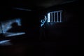 Jail or prison cell. Man in prison man behind bars concept. Old dirty grunge prison miniature. Dark prison interior creative Royalty Free Stock Photo