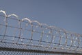 jail wall. highly protected prison wall with barbed wire fence. steel grating fence. Royalty Free Stock Photo