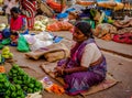 JAIPUR, INDIA - AUGUST 25 2017: Indian women sells assorted food in the streets in Jaipur, India. In India poor women