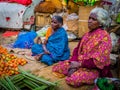 JAIPUR, INDIA - AUGUST 25 2017: Indian women sells assorted food in the streets in Jaipur, India. In India poor women