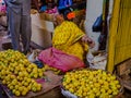 JAIPUR, INDIA - AUGUST 25: Indian women sells food in the streets in Jaipur, India. In India poor women often sell