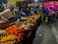 Jaipur, India, circa 2021 : Picture of a flower vendor and a flower market