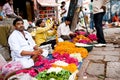Jaipur, India - Jule 29: Men threading colourful flower garlands on Jule 29, 2011, Jaipur, India. These flowers are offered to the