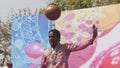 JAIPUR, INDIA - MARCH 21, 2019: a male indian dancer balances a jar on his head at a holi party in jaipur