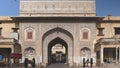JAIPUR, INDIA - MARCH 22, 2019: wide view of archway with antique cannon at the entrance to city palace in jaipur