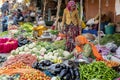Food trader selling vegetables in street market. Jaipur, Rajasthan, India