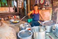 Jaipur, India - September 20, 2017: Unidentified man cooking Indian food in a metallic tray over incandescent rocks in