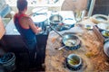 Jaipur, India - September 20, 2017: Unidentified man cooking Indian food over a wooden table with some material next to