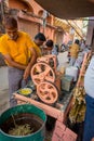 Jaipur, India - September 20, 2017: Unidentified man working with a machine to extract refreshing juice from sugar cane Royalty Free Stock Photo