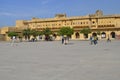 Jaipur, Rajasthan, India: Majestic courtyard of Amber Fort in Jaipur, tourists enjoying the architecture of the palace Royalty Free Stock Photo