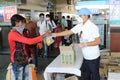 Distribution of food items and water at railway station to Indian migrant laborers leaving the city due to covid-19 pandemic.