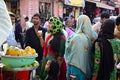 Indian woman drinks fruit juice on the street market