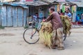 JAIPURHAT, BANGLADESH - NOVEMBER 6, 2016: Local man with a loaded bicycle in Jaipurhat, Banglade