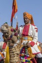 Camel and indian men wearing traditional Rajasthani dress participate in Mr. Desert contest as part of Desert Festival in Jaisalme