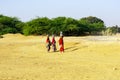 Indian ladies carrying a water bucket near Thar desert