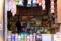 An Indian vendor waiting for customer at his grocery store