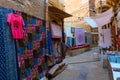 Colourful ladies clothes are displayed for sale to tourists in market place