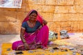 Jaisalmer, Rajasthan, India - October 13, 2019 : Rajasthani woman selling jewelleries in market place Inside Jaisalmer Fort .