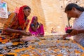 Rajasthani women selling and negotiating price of jewelleries with female tourist