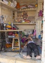 Jaisalmer Rajasthan India, 03.24.2023 tailor sleeps on the floor in his workshop